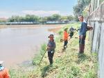 กำจัดผักตบชวา และวัชพืชริมคลองภายในเขตพื้นที่เทศบาลตำบลพานทอ